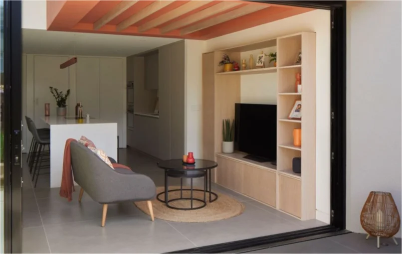 This image depicts an open plan living room, showing off the inside of the cube house.