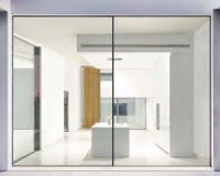 A picture of Cobalt Aluminium's product, called Cor Vision Plus. It could be a painting, but is a window. This is how we can describe the COR 70 Hidden Sash which, like the 80 mm version, has a sightline of only 66 mm and allows the incorporation of the ARCH INVISIBLE handle, concealed hinges and the drainage solution. Any element that breaks the visual harmony of the ensemble is discarded.